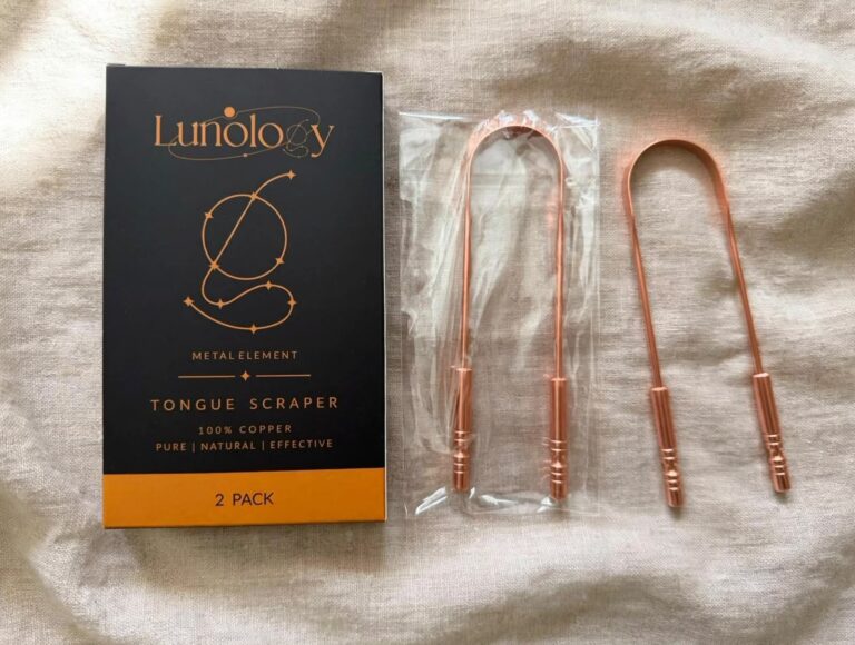 Two 100% pure copper tongue scrapers beside the open Lunology box