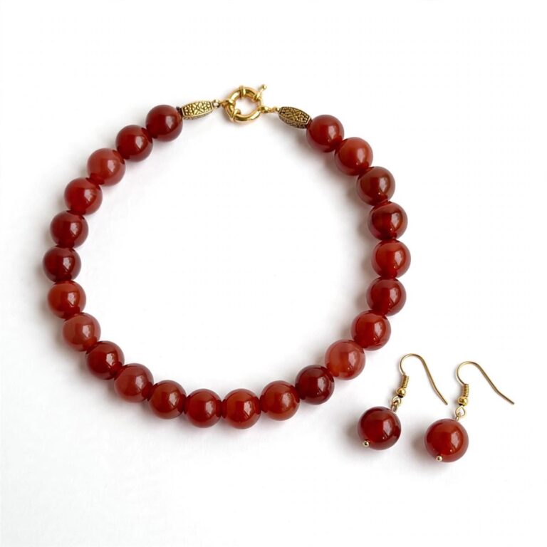 Natural carnelian necklace with polished beads and an ornate gold clasp
