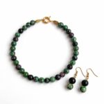 Natural jade necklace in tourmaline colors with polished 9mm beads and a gold clasp
