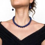 Natural lapis lazuli necklace with polished beads and an elegant gold clasp