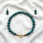 Compressed Sinai turquoise necklace with polished beads and an ornate gold clasp