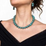 Compressed Sinai turquoise necklace with polished beads and an ornate gold clasp